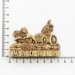 Detailed view of resin Madrid souvenir magnet showing chariot sculpture with a ruler scale