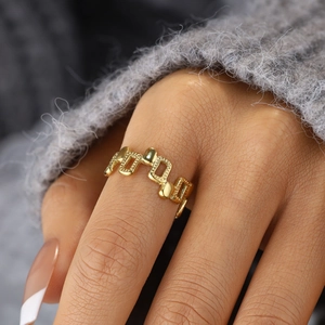 Minimalist irregular geometric open ring with 18k gold plating on model finger