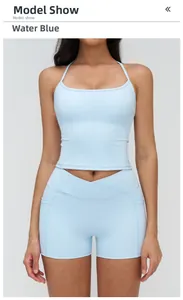 Detail of high-waisted yoga shorts with crossover waistband and side pockets in blue