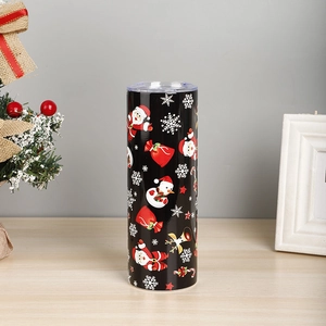 Macro shot of 20oz Christmas thermal tumbler with Santa patterns on wooden table