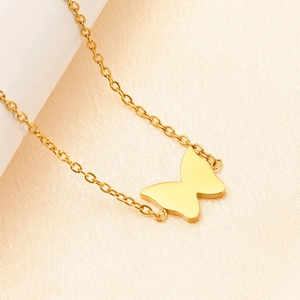 Elegant gold butterfly pendant necklace with minimalist silhouette and fine O-chain