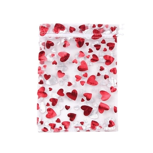 Transparent organza gift bag with red and silver heart patterns and drawstring closure