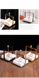 Detail of luxury metal napkin holders with crystal accents in gold, silver, and black finishes
