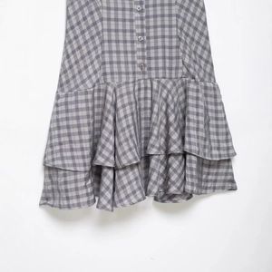 Fashionable grey plaid layered dress with button details and triple ruffle hemline