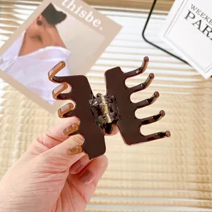 Brown tortoiseshell acetate hair claw clip for elegant French style hair styling