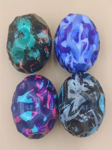 Detail of high-bounce foam moon balls with colorful graffiti patterns for stress relief