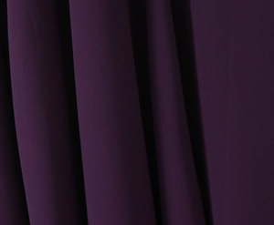 Detailed macro view of dark purple pleated chiffon fabric texture and material quality