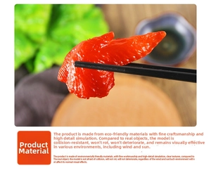 Macro shot of realistic fake chicken wing model held by chopsticks for display