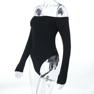 Close-up of black off-shoulder bodysuit featuring elastic fabric and slim-fit long sleeves