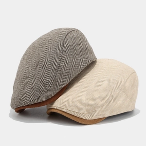 Classic herringbone newsboy caps in charcoal and beige for men and women