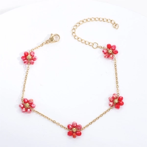 Detail of red crystal flower bracelet with gold chain and adjustable lobster clasp