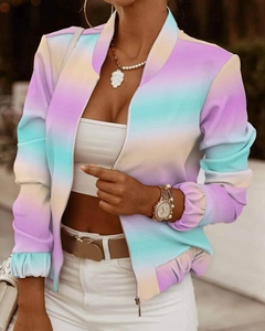 Detail of a purple and yellow gradient jacket featuring a silver zipper and elastic cuffs