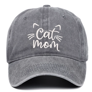 Close-up of white Cat Mom embroidery and cat whiskers on grey washed cotton baseball cap
