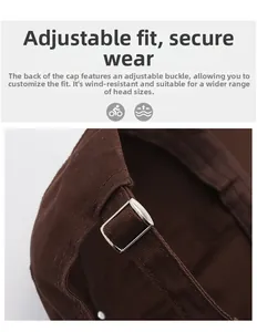 Detail of adjustable metal buckle on brown distressed cotton baseball cap for custom fit