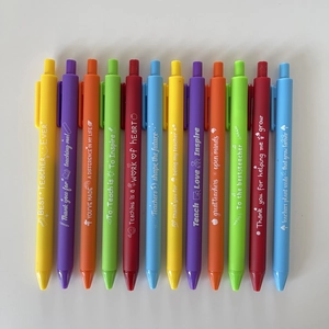 Close-up of 12 colorful retractable pens with white Teacher Appreciation quotes on matte barrels