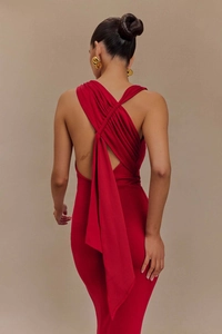 Detailed back view of a slim red maxi dress featuring an elegant crisscross knot design