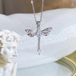 Exquisite silver dragonfly pendant necklace with sparkling cubic zirconia on white background