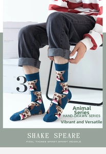 Close-up of crew socks featuring a navy blue base with cute bulldog head patterns