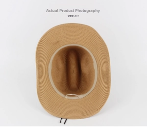 Detailed top view of a tan straw cowboy hat with adjustable interior sweatband and weaving