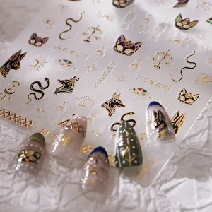 3D embossed Egyptian nail art stickers featuring gold Horus eye and Anubis symbols