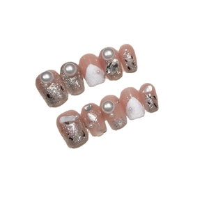 Handmade nude pink press-on nails with silver glitter, white pearls and shell textures