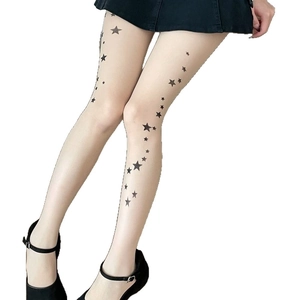 Nude sheer star print tights with black star patterns and Mary Jane shoes
