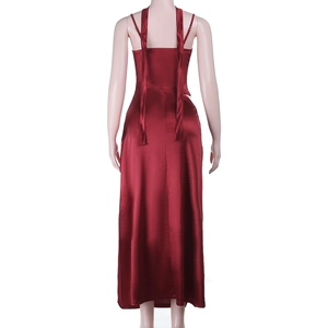 Detail of red satin evening dress featuring a low back design and delicate lace trim