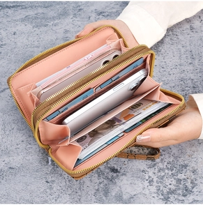 Internal view of a double zipper long wallet with brown floral print and pink lining