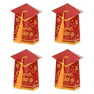 Red graduation cap gift boxes with yellow tassels and Congrats Grad text for party favors