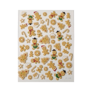 3D embossed Christmas nail stickers featuring gingerbread man and festive holiday patterns