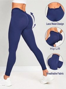 Detail view of high waist yoga leggings showing lace waist design and hip lift effect
