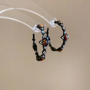 Vintage C-shaped tiger eye stone earrings with silver needle and black enamel finish