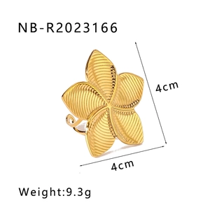 Detail of 4cm gold flower ring showing textured petals and adjustable open band