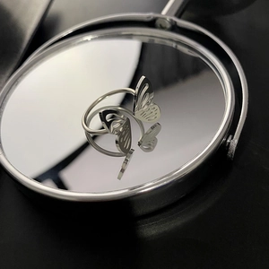 Minimalist silver butterfly open ring with polished hollow design on mirror surface