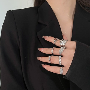 Detail of silver alloy ring set with lava flow design and resin stones on model
