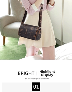 Detail view of a brown cylindrical Boston bag featuring all-over geometric monogram patterns
