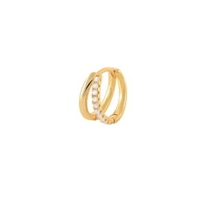 Macro detail of gold-plated double-layer hoop earrings with sparkling cubic zirconia pavé
