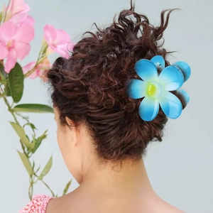 Blue gradient flower hair claw clip for women's ponytail styles on brunette wavy hair