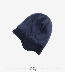 Detailed view of the dark blue winter hat with warm fleece lining and ear protection