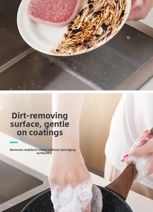 Dual-sided pink kitchen sponge demonstrating grease removal and rich foam on dishes