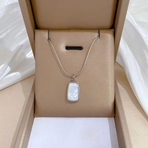 Titanium steel square shell pendant snake chain necklace displayed in a jewelry box