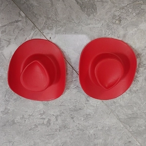 Top view of two mini red cow-pattern plastic cowboy hats for doll DIY accessories