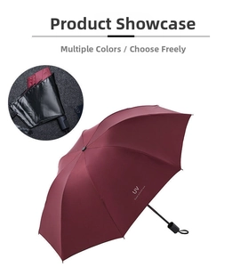 Detalle del paraguas granate plegable de tres secciones con protección UV e impermeable