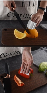 Macro shot of durable stainless steel finger guard for safe vegetable cutting in kitchen