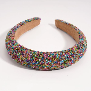 Detailed close-up of Baroque headband featuring colorful gemstones and brown velvet lining