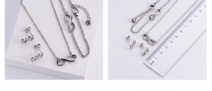 Detailed view of silver infinity jewelry set with necklace bracelet and earrings dimensions