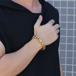 Men's bold gold-plated stainless steel motorcycle chain bracelet worn on wrist