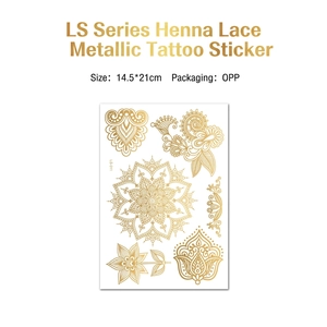 Bohemian gold metallic henna tattoo with large mandala flowers and lace patterns