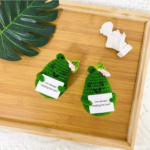 Handmade crochet avocado couple plush toys with positive cards on a wooden tray
