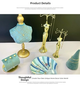 Golden bust mannequin and green velvet stands for necklace and jewelry display